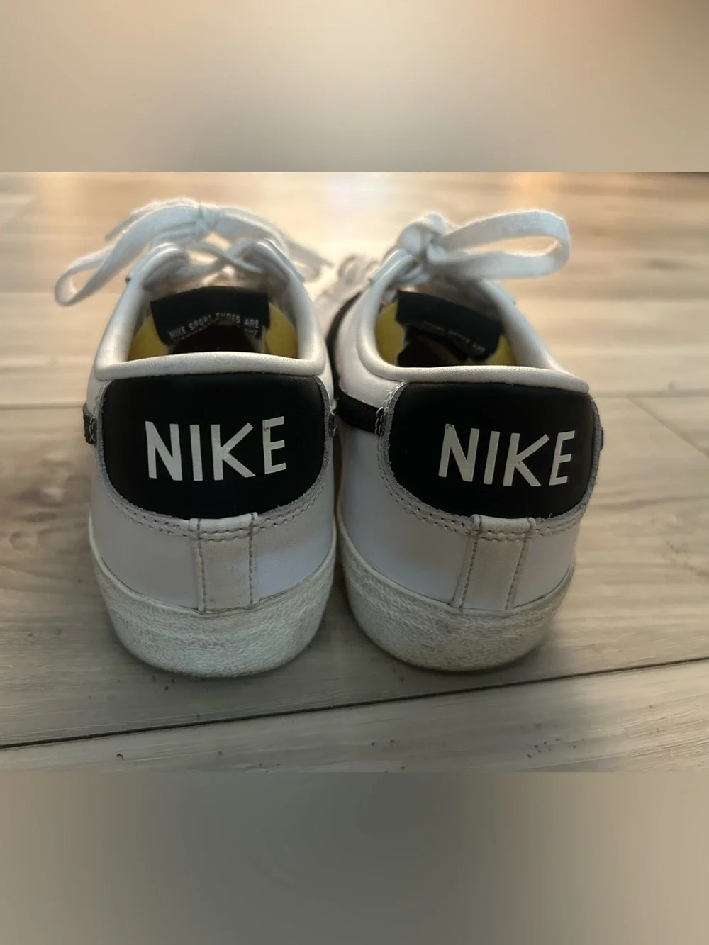 Nike White and Black Low-Top Sneakers with Yellow Tongue Accent